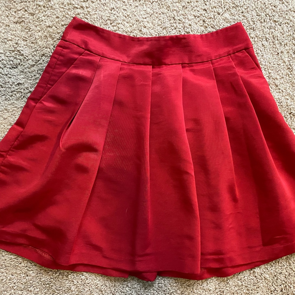 Red pleated skirt